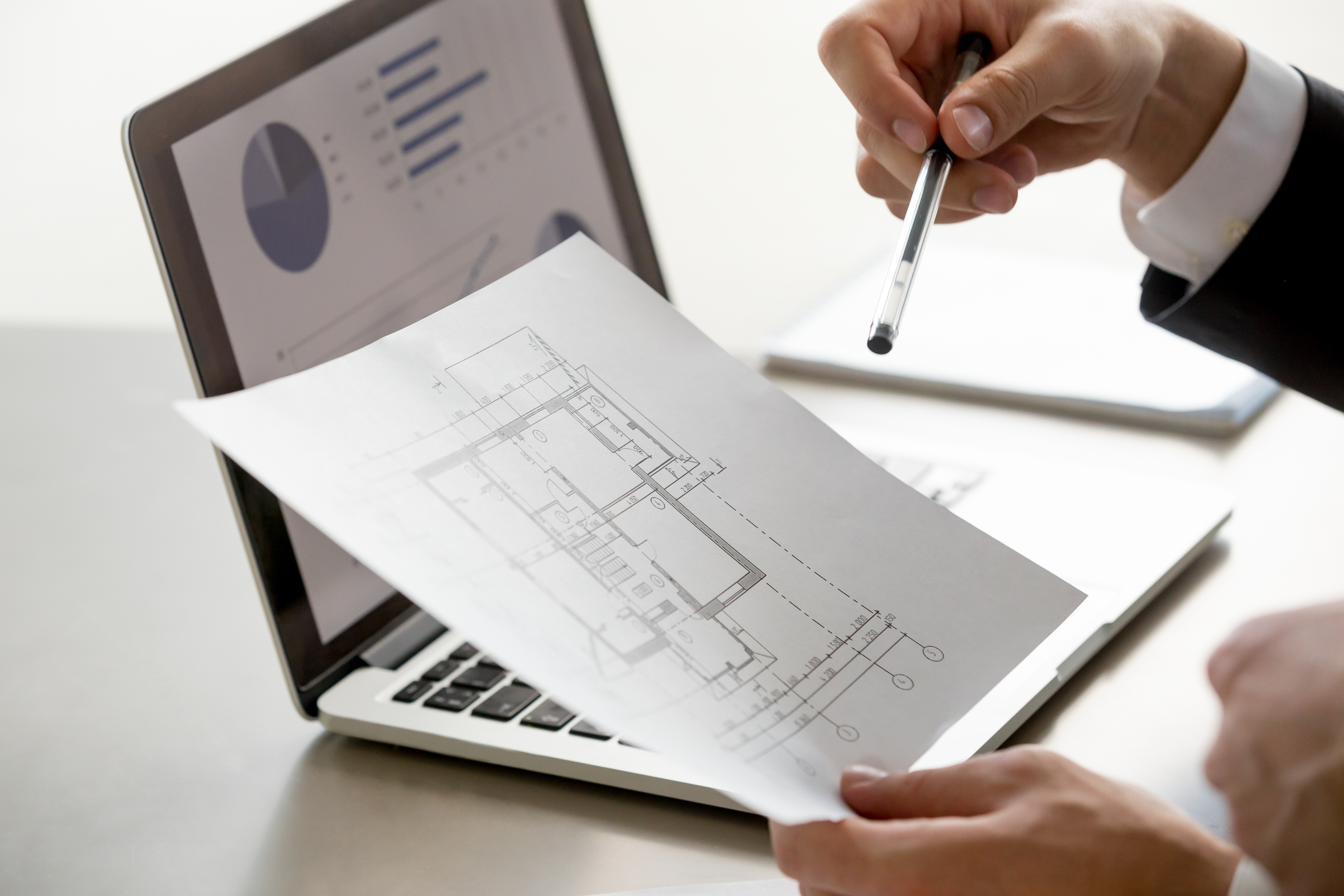 Estimator reviewing project documents and cost analysis